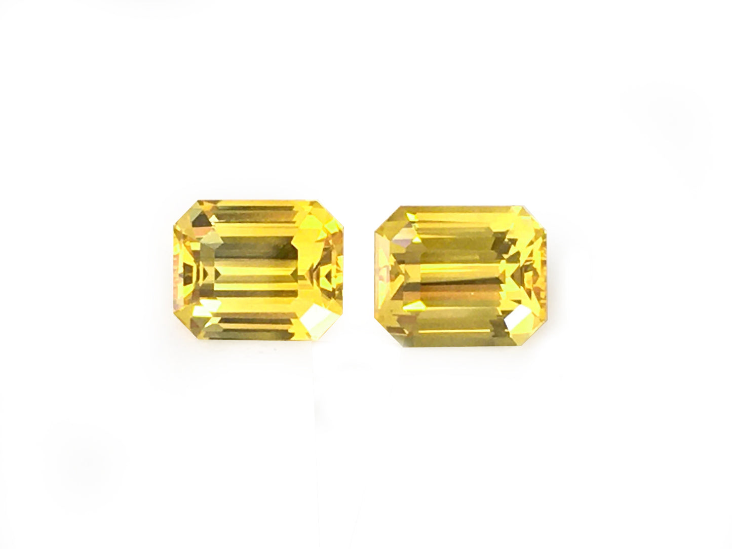 Matching PAIR of Octagonal-shape 4.12 carat Orangy-Yellow Sapphire - GIA Certified