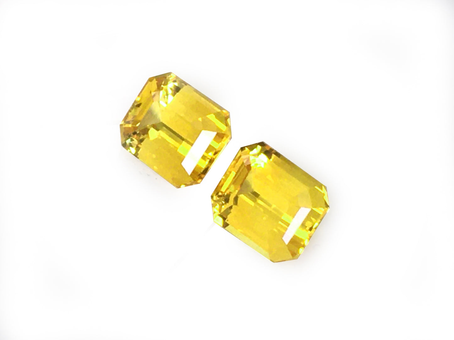 Matching PAIR of Octagonal-shape 4.12 carat Orangy-Yellow Sapphire - GIA Certified